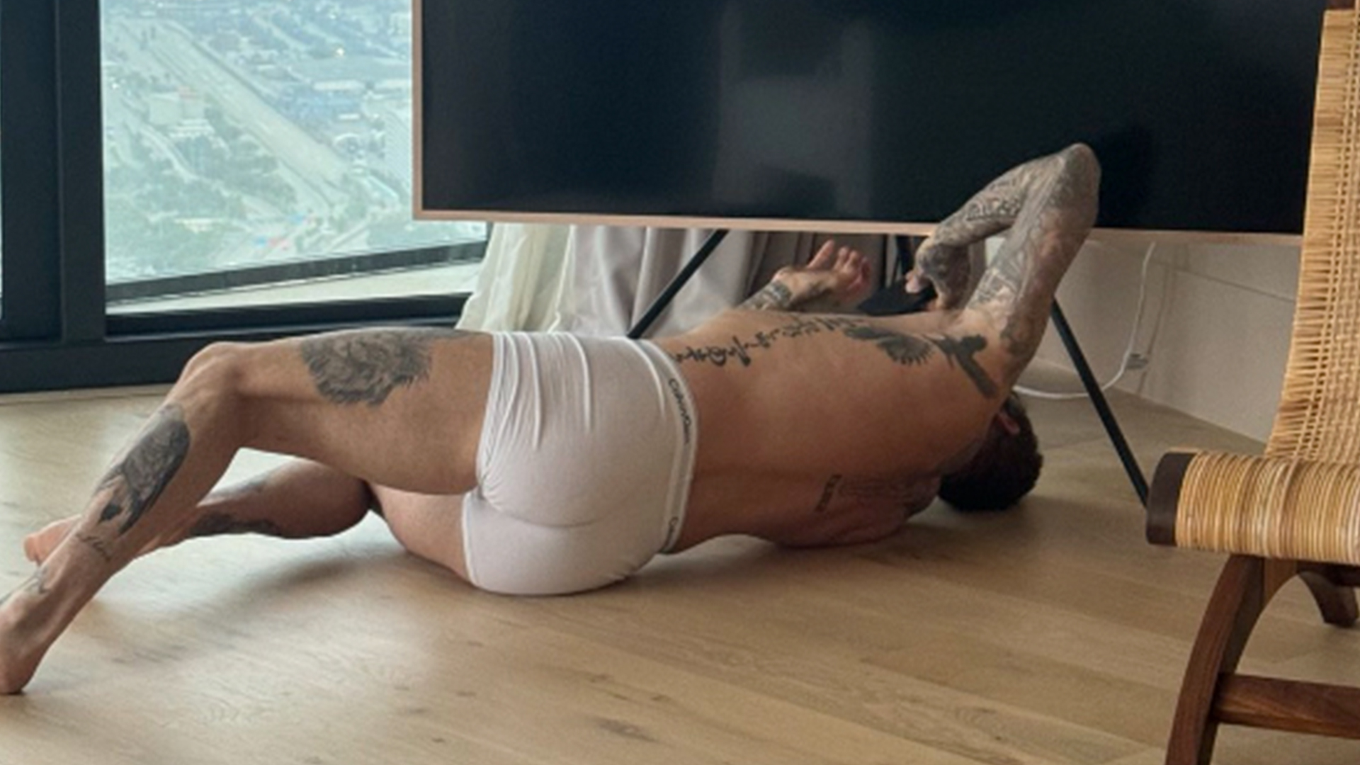 Man Utd legend David Beckham fixes TV in just his boxers as wife Victoria tells fans ‘you’re welcome’