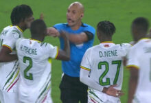 Shocking moment ref is forced to push away furious Mali players who swarm round him after dramatic Afcon loss